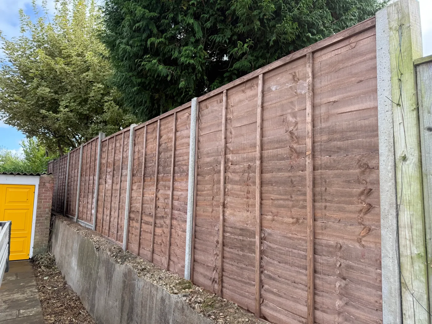 Garden boundary fencing behind a Surrey home