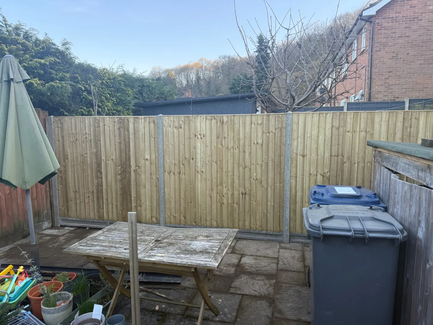 New garden fencing with concrete posts in a back garden