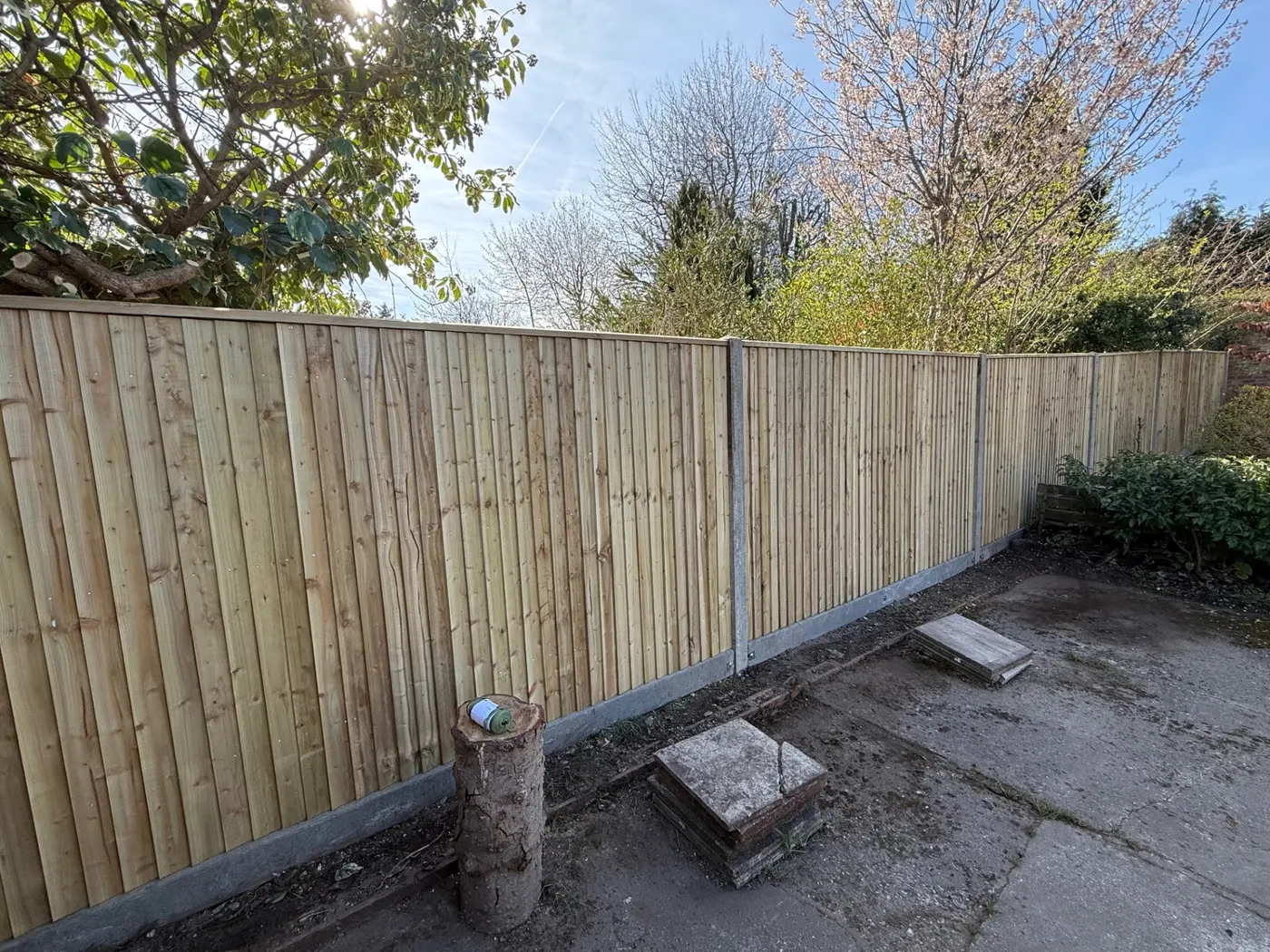 New closeboard fence panels with concrete posts and gravel boards