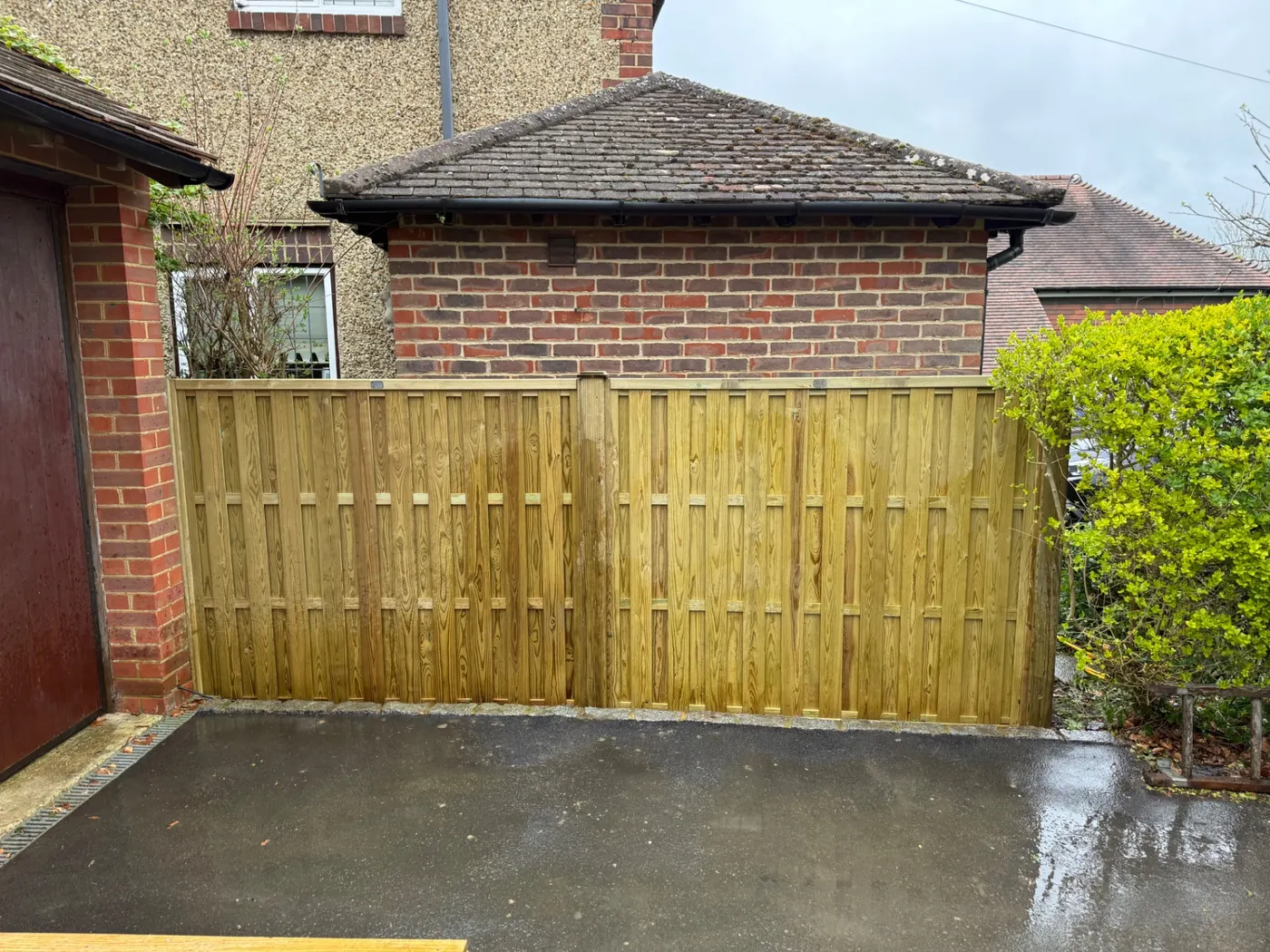 Tongue and groove timber driveway gates installed in Guildford