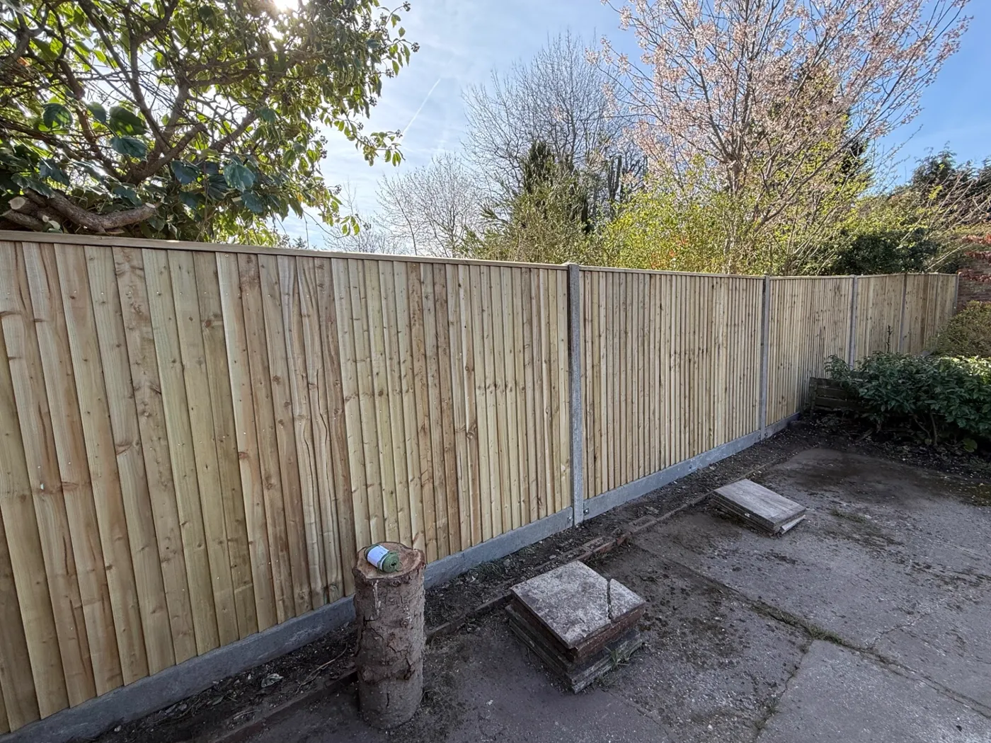 Feather edge closeboard fence with concrete posts along a Guildford boundary