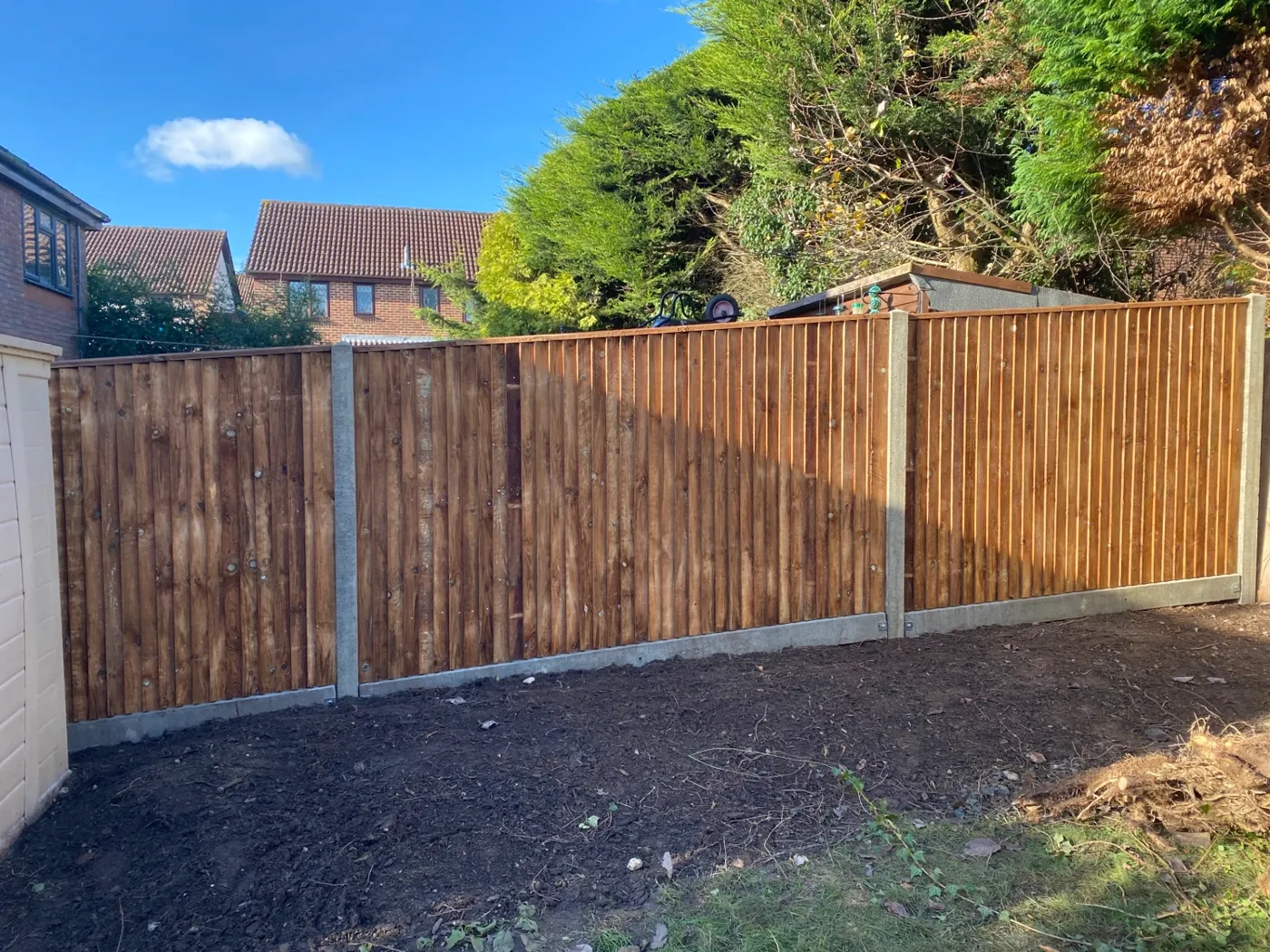 New closeboard fence with concrete posts and gravel boards in a Guildford garden