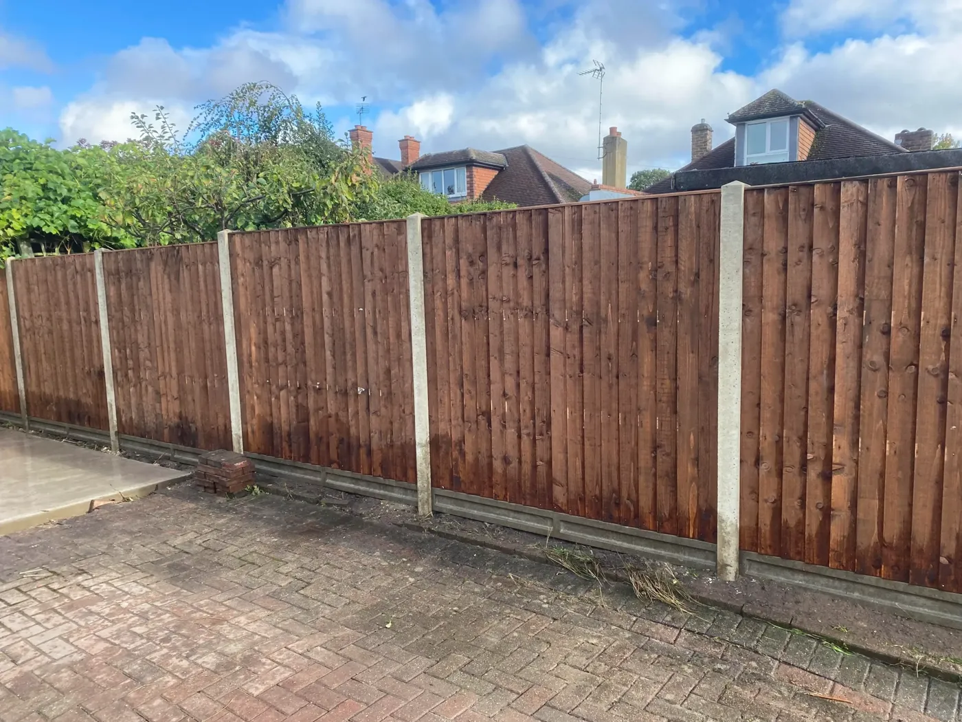 Closeboard panel fencing with concrete posts