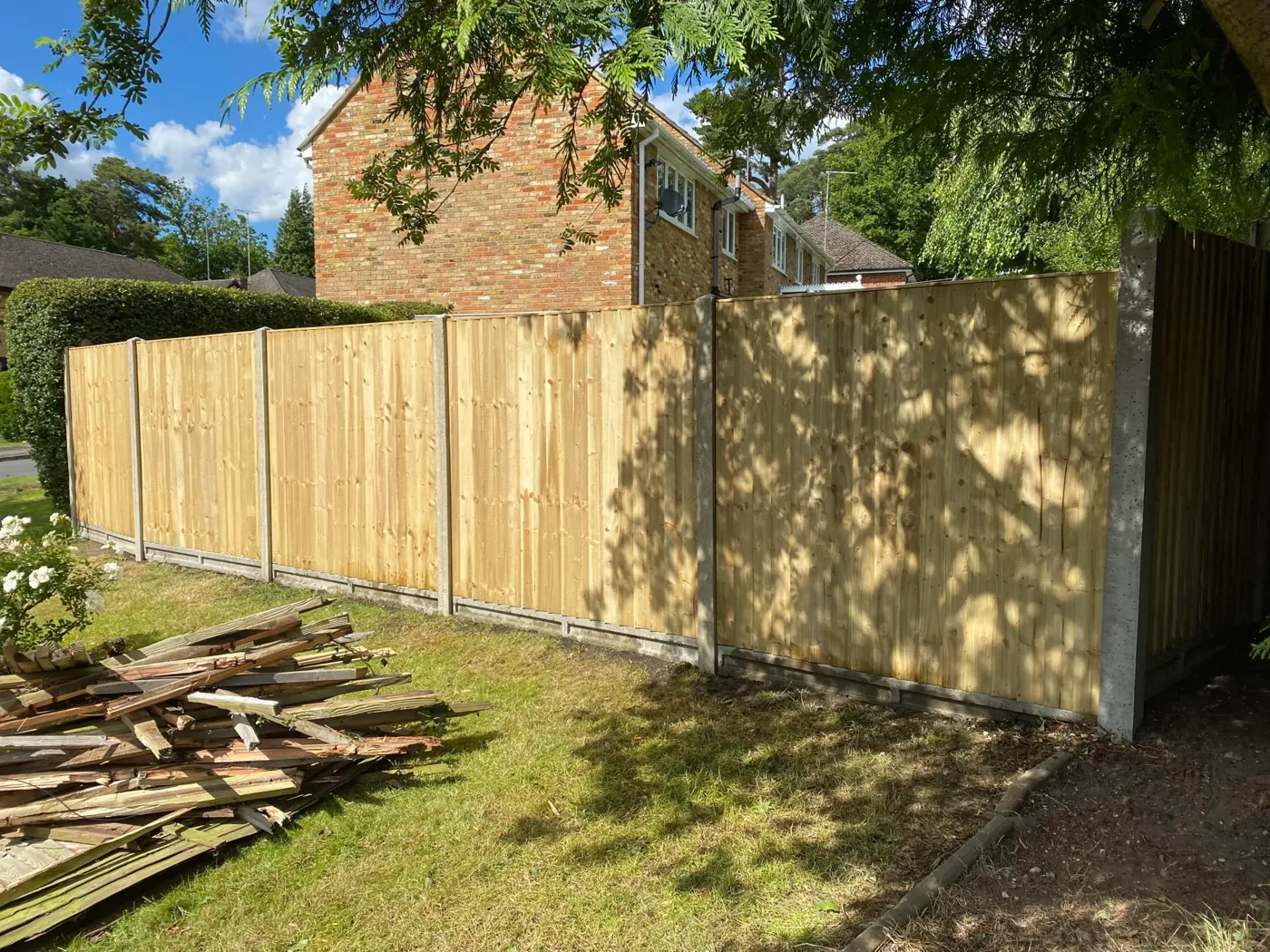 New timber fence installed along a garden boundary